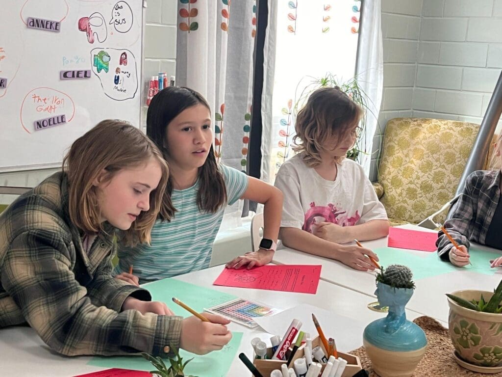 Students work together to finish task at micro school in Austin.
