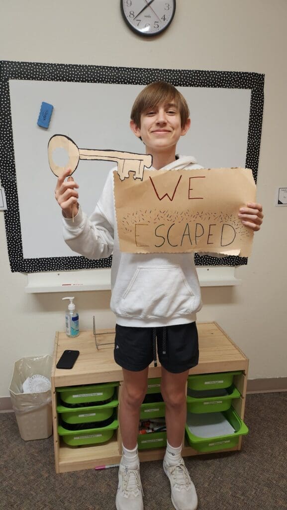 Student at private middle school holds key to escape room.