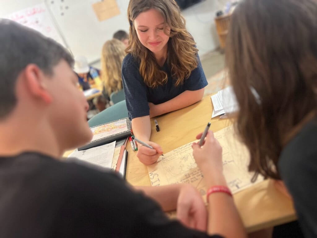 Middle school students work together at micro school.