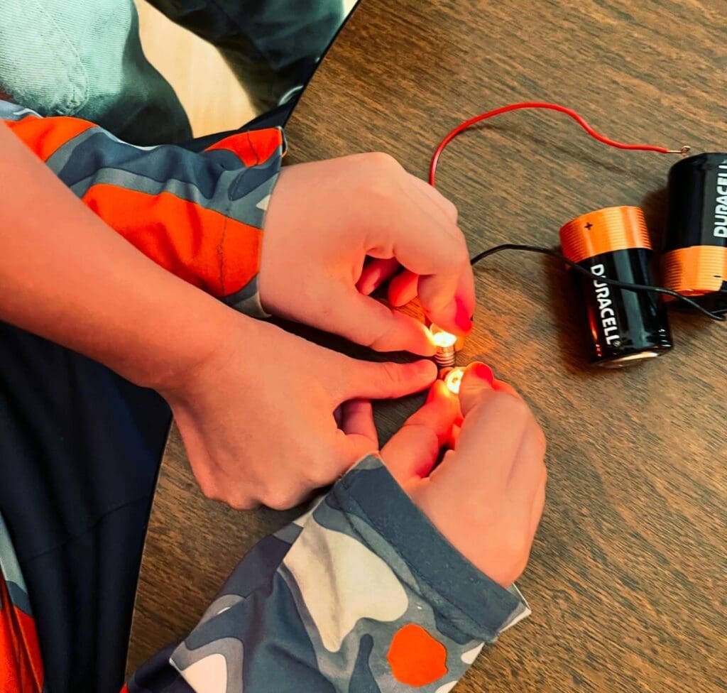 Two third graders work together on circuit at STEM school.