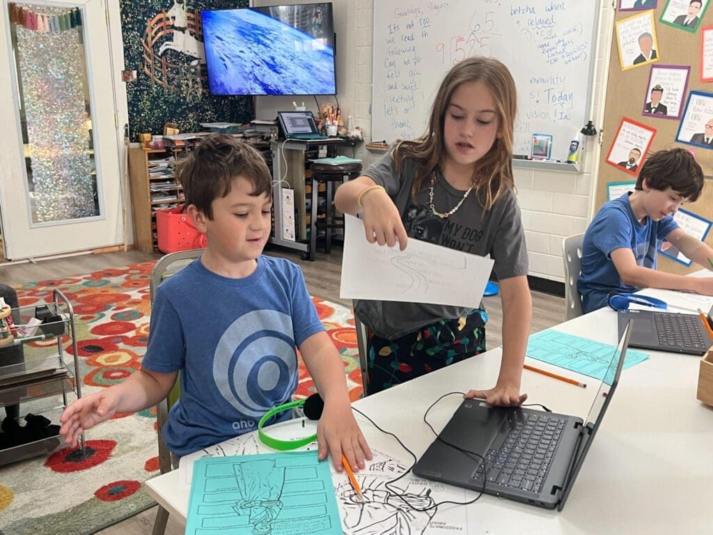 Two fourth grade students work together at computer at STEM school in Austin.