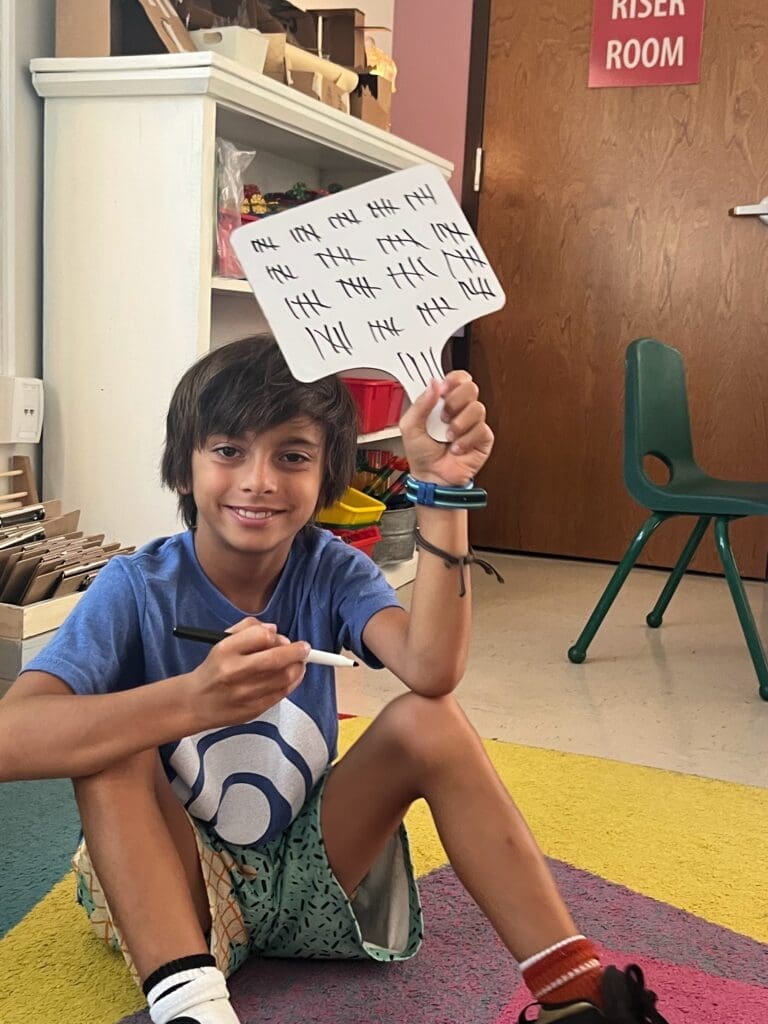 Student displays math work at STEM school