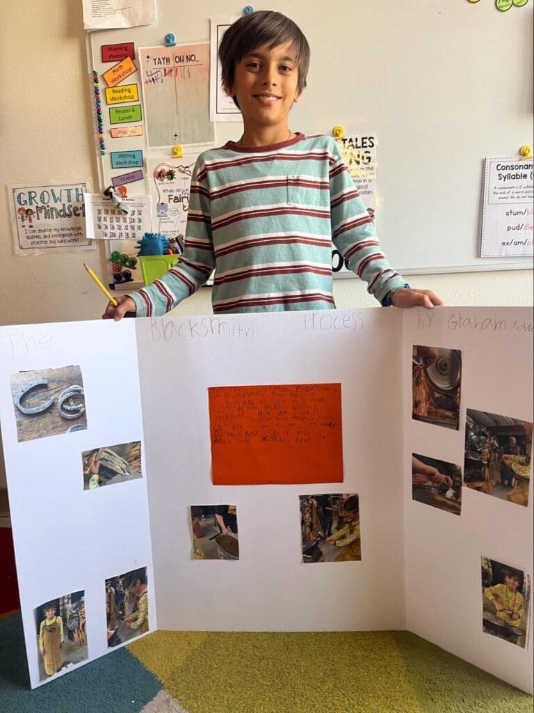 Elementary student displays work at project based school.