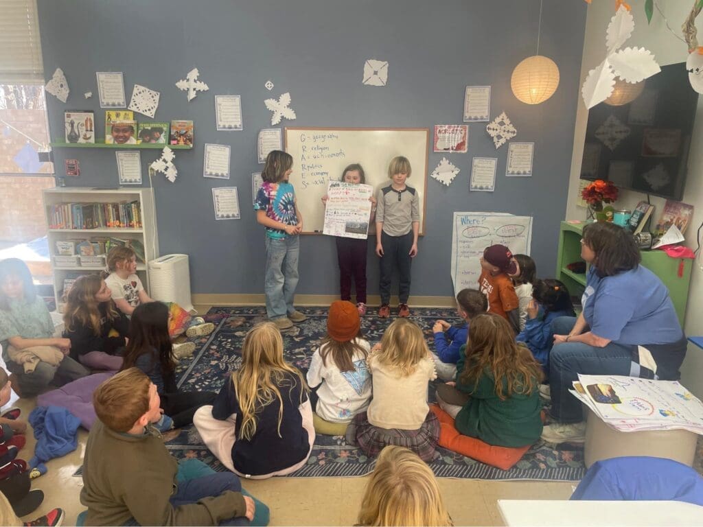 Elementary students give presentation at school with small classes.