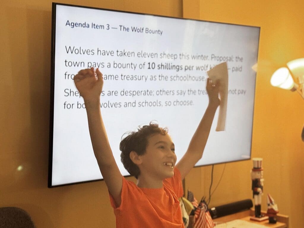 Middle school boy raises arms at nonreligious school.