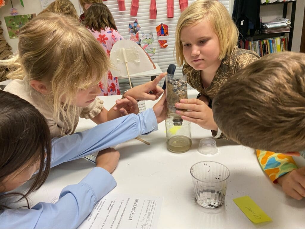 Elementary students work together at micro school.