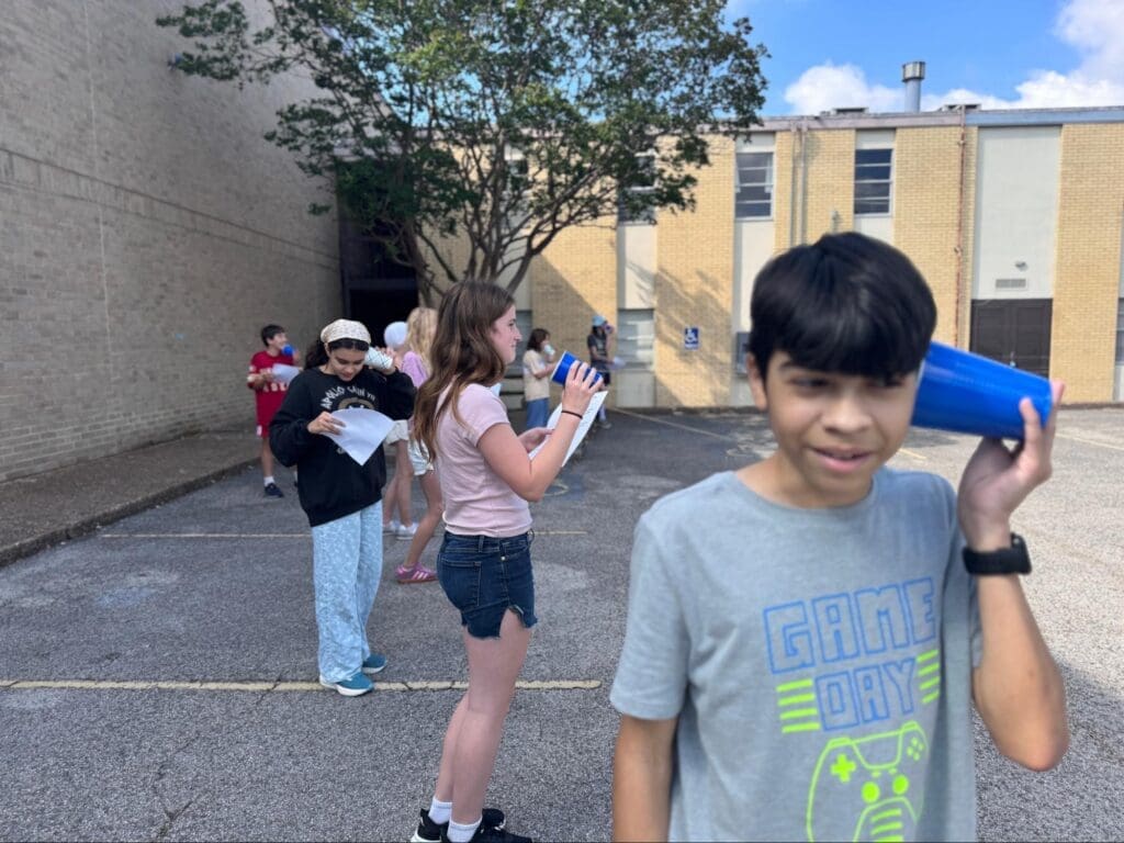 Middle schoolers test theory at STEM school.